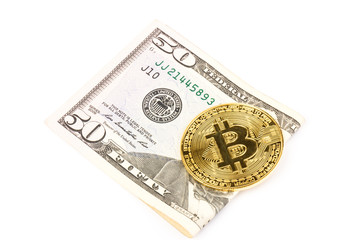 Bitcoin, fiftydollar bills on  white background. Business, money, cryptocurrency concept.