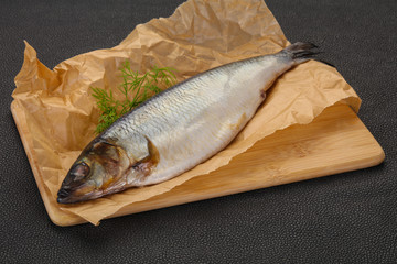 Salted herring over the wooden board