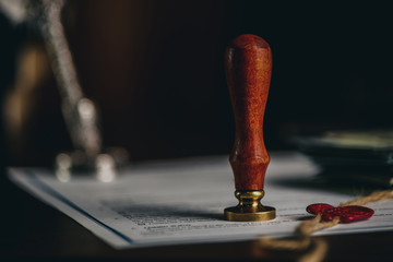 Notary's public pen and stamp on testament and last will. Notary public tools.