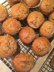 Vertical view of muffins on a wire rack after baking