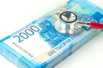 stethoscope and money, the concept of overcoming the crisis