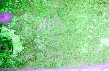 Fragment of old house wall close-up. Green background. Peeling plaster on concrete surface. tinted green. Cracks in paint. Copy space. Place for text. 