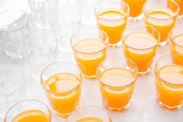 many glasses with fresh juice