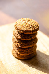 stack of oatmeal cookies on a wooden board