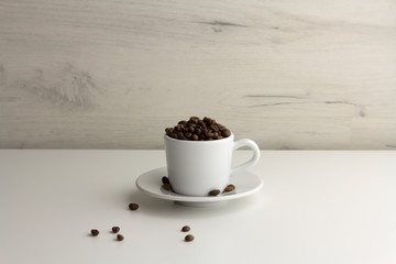 Cup is full of coffee beans