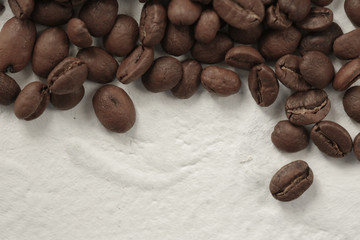 coffee beans are scattered on the table
