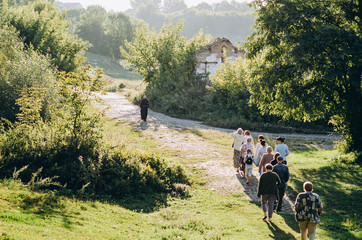 monk and pilgrims go on a nature pilgrimage, view from afar