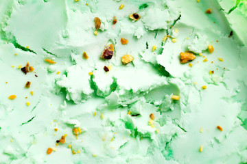 Natural food background from fresh cold pistachio light green ice cream or gelato.
