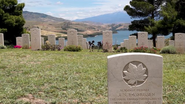 Canadian war cemetery, unique in Italy, is located on a green hill in front of Etna in the municipality of Agira in Sicily.