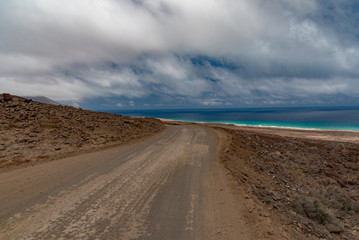 Fototapeta na wymiar ocean and mountains in the desert of the Canary Island of Fuerteventura