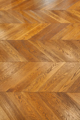 Fragment of brown wooden parquet floor.
