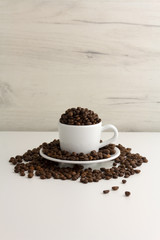 Cup is full of coffee beans