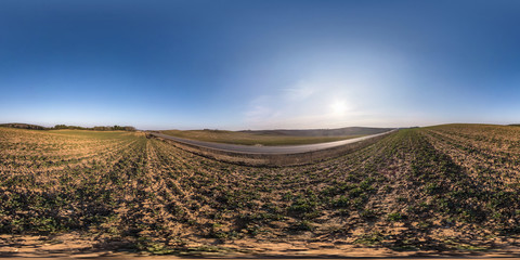 full seamless spherical hdri panorama 360 degrees angle view on among fields in spring evening with awesome clouds in equirectangular projection, ready for VR virtual reality content