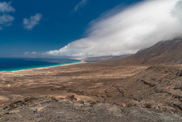 Fototapeta na wymiar ocean and mountains in the desert of the Canary Island of Fuerteventura