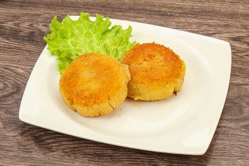 Vegan cuisine - Potato cutlet in the plate