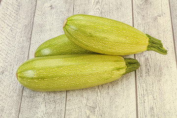 Young tasty zucchini over board