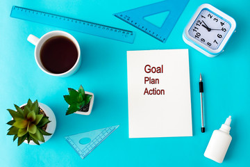 Goal, plan, action is on notepad with office accessories. Business inspiration, motivation, professional performance