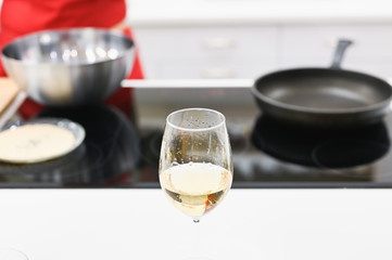 glass of champagne on the background of the kitchen. large view