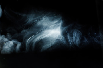 Obraz premium Ray of light with smoke and fog spotlights on the stage. Scene light equipment