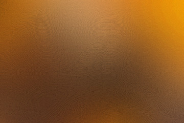 Naklejka premium Orange background texture. Orange-black color. Halloween background. Abstract background. The effect of the texture of the board. Fiery color. Material.