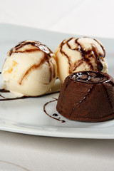 petit gateau with ice cream and chocolate sauce.