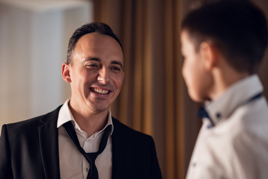 Father and son talking after an an official event