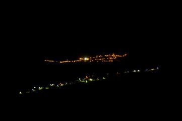Town of Artenara to the background and village of El Toscon to the foreground at night. Gran Canaria. Canary Islands. Spain.