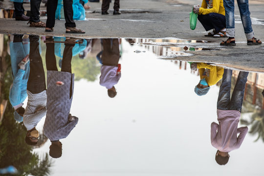 People wait for hours in long queues for Covid-19 tests at BSMMU fever clinic near Shahabagh in the capital of Bangladesh ,Monday morning on April 20,2020. Photo:Saikat Bhadra