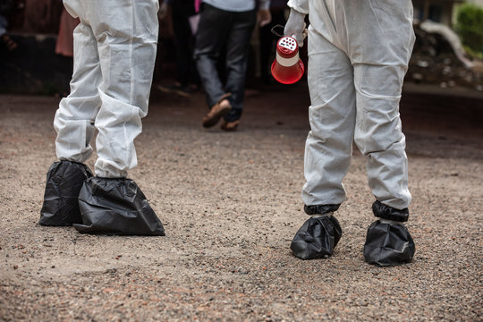 Two security personnel covered their shoe with polythene bag for disinfect Covid-19 at BSMMU fever clinic in the capital of Bangladesh on April 20,2020.Photo:Saikat Bhadra 