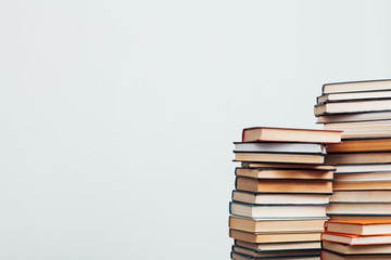 a lot of stacks of educational books in the library on a white background