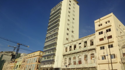 Fototapeta premium Havana is an original city with old mobiles and old houses