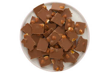 Delicious milk chocolate with hazelnuts on White background