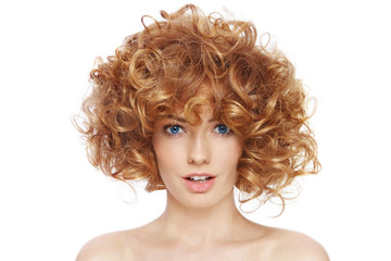 Young beautiful happy woman with curly hair over white background