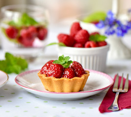 Mini tart with raspberries fruits on the table
