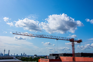 Red crane working to create new building