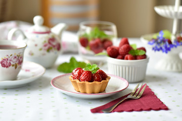 Mini tart with raspberries fruits on the table
