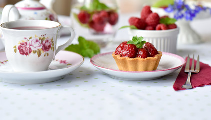 Mini tart with raspberries fruits on the table

