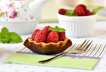 Mini tart with raspberries fruits on the table
