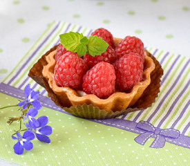 Mini tart with raspberries fruits on the table
