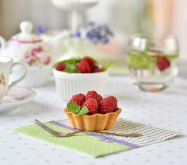 Mini tart with raspberries fruits on the table
