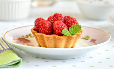 Mini tart with raspberries fruits on the table
