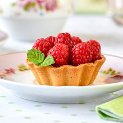 Mini tart with raspberries fruits on the table
