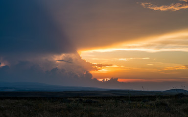 Steppe skyline and wonderful clouds at sunset