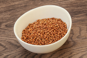 Raw buсkwheat cereal in the bowl