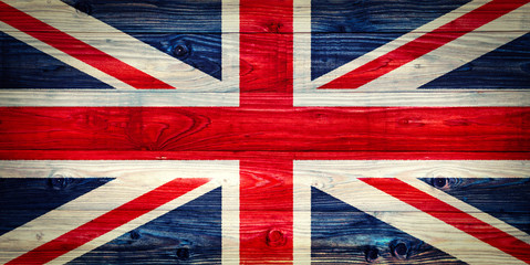 An old Union Jack on wooden surface