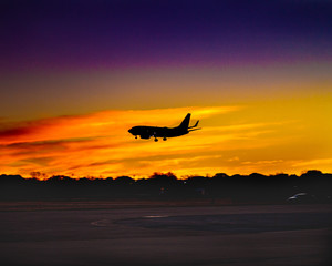 Fototapeta na wymiar sunset aircraft landing 