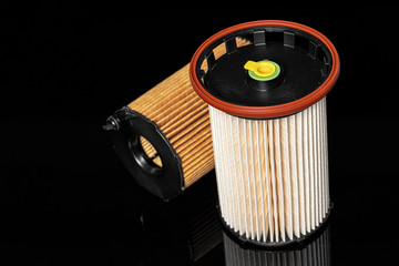 Car engine filter on dark background.