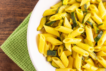 Penne pasta with zucchini and saffron.