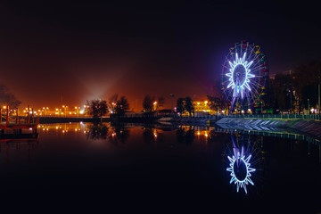 Ferris wheel at night over water