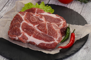 Raw pork neck steak